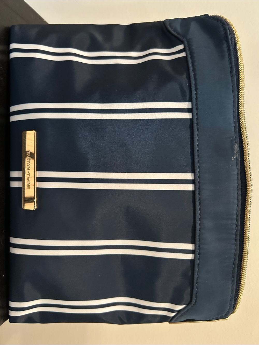 Tignanello Navy and White Striped Toiletry Bag with Gold Accent